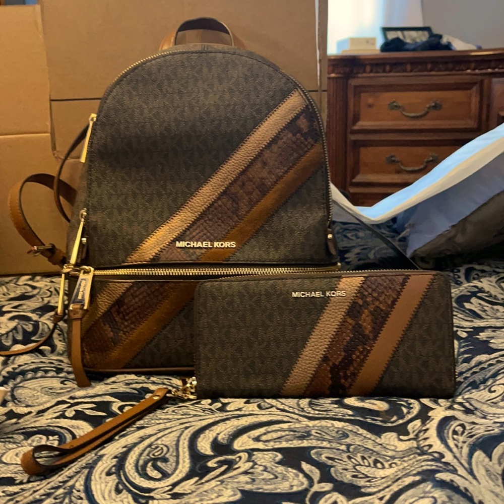 Like new Michael Kors backpack and matching wallet